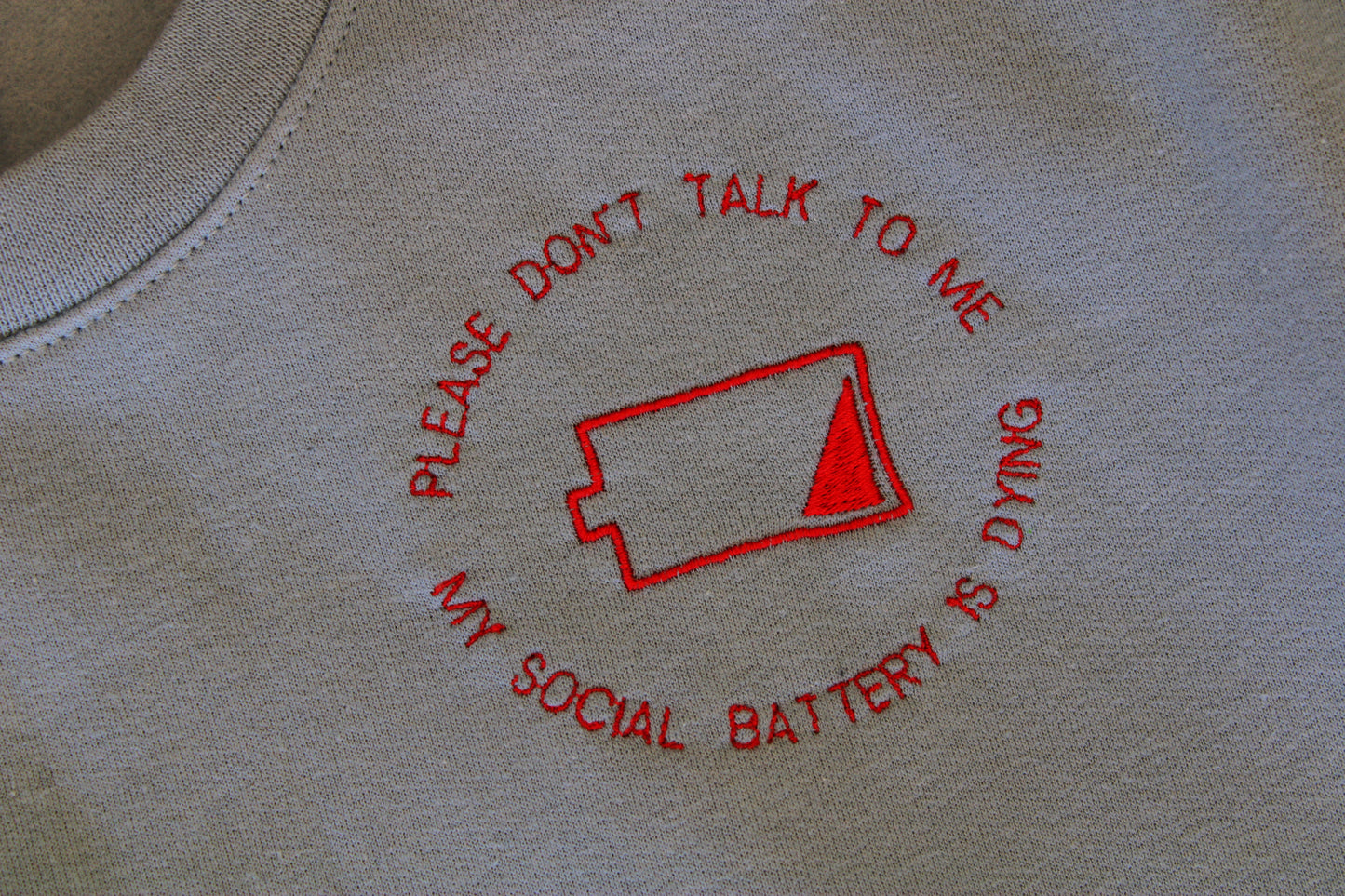 Social Battery Embroidered Sweater